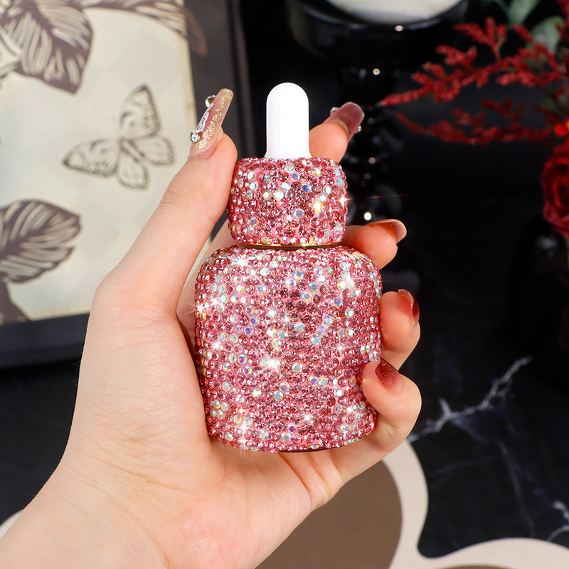 Luxury Skincare Essence - ผลิตภัณฑ์ดูแลผิวสูตรน้ำมันหอมระเหยสำหรับการเดินทางแบบหรูหรา บรรจุในขวดแก้วขนาดพกพา พร้อมหัวหยดแก้วประดับเพชร